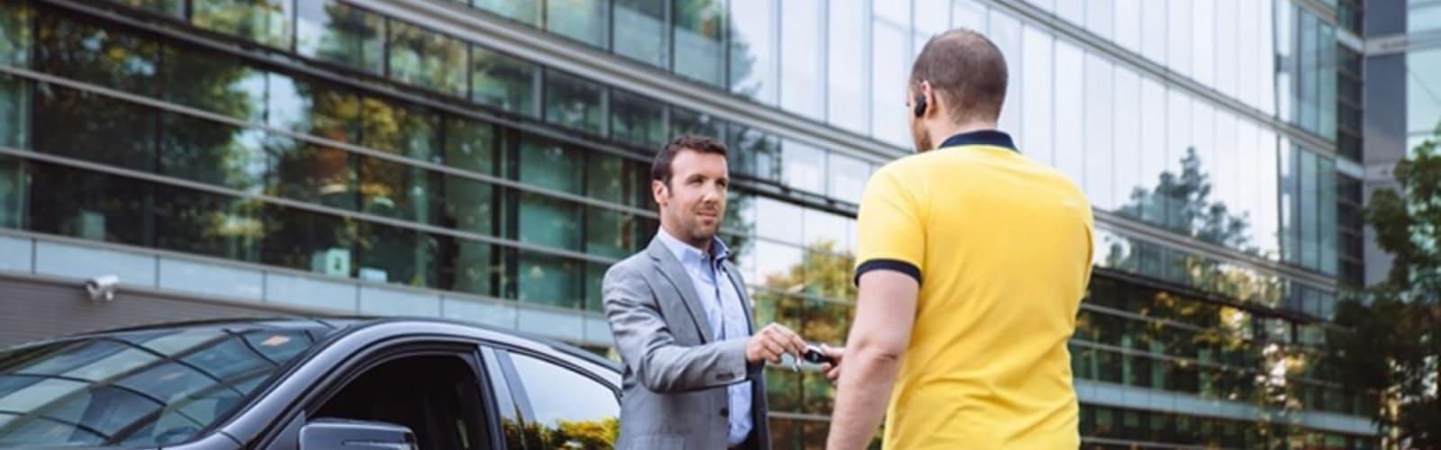 man giving car keys to velet parking ibiza